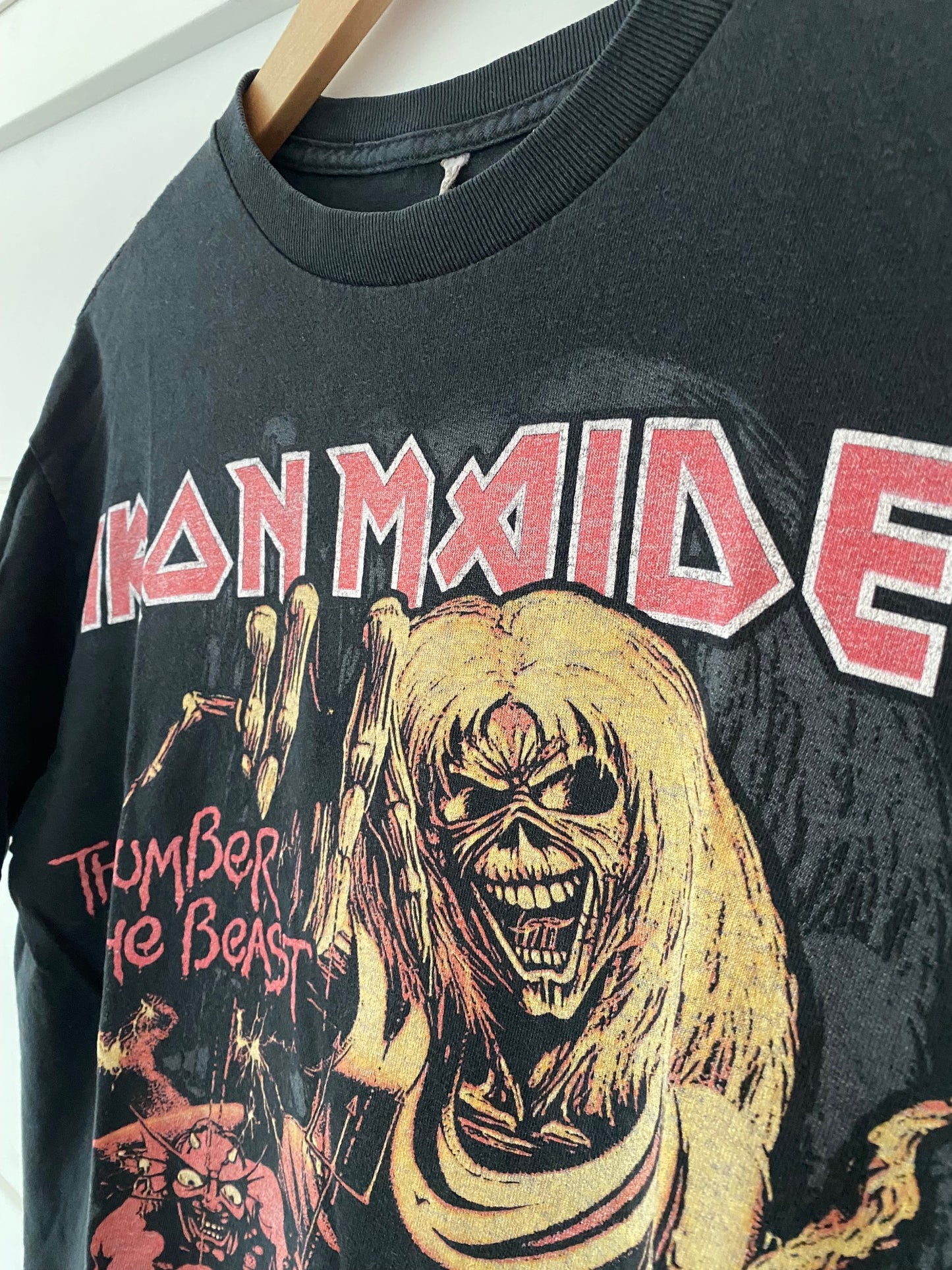close up of black short sleeve t-shirt iron maiden skull the number of the beast with devil