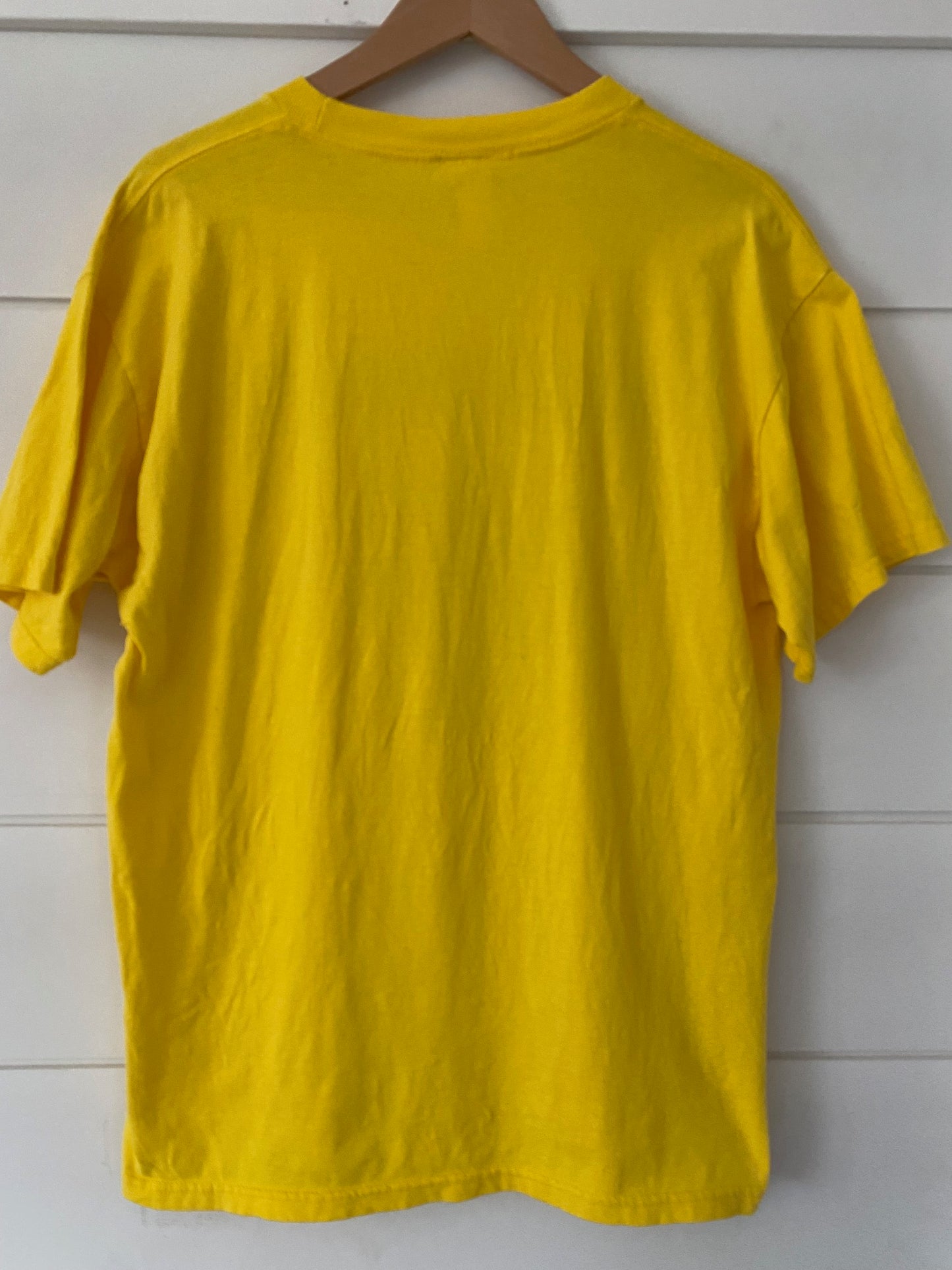back of a plaint yellow t-shirt