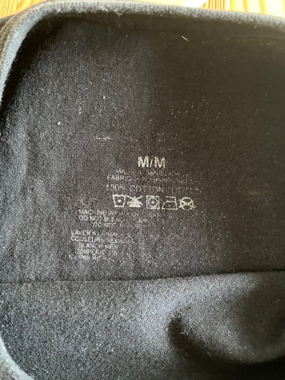 tag inside black t-shirt size medium