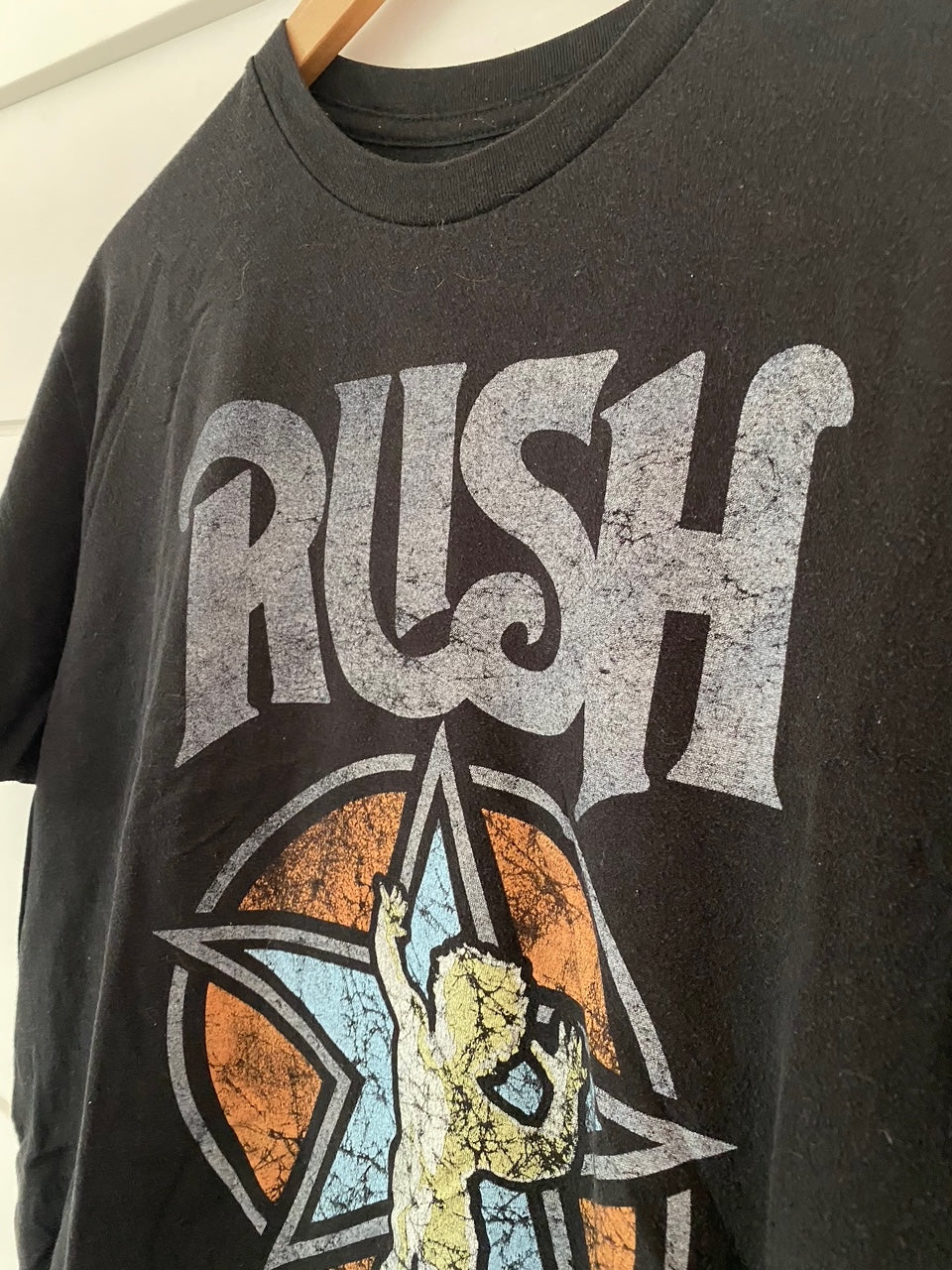 close up of the word rush t-shirt with a bleu star and a person