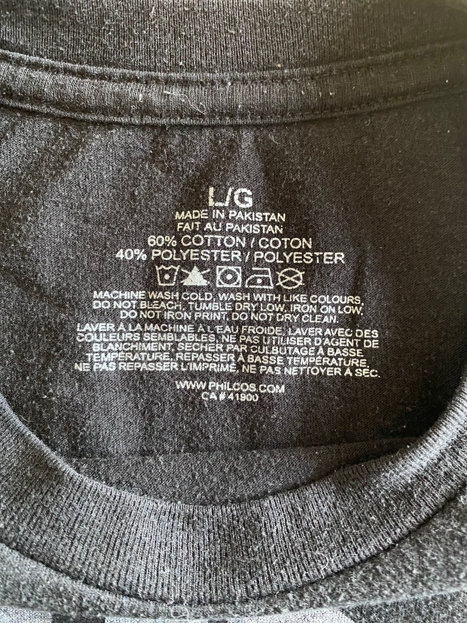 large label and car instructions inside black t-shirt