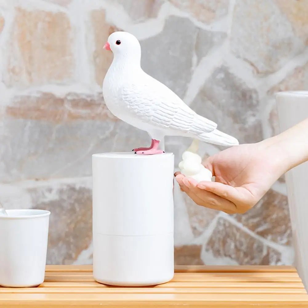 white pigeon on a round white soap bottle dispensor