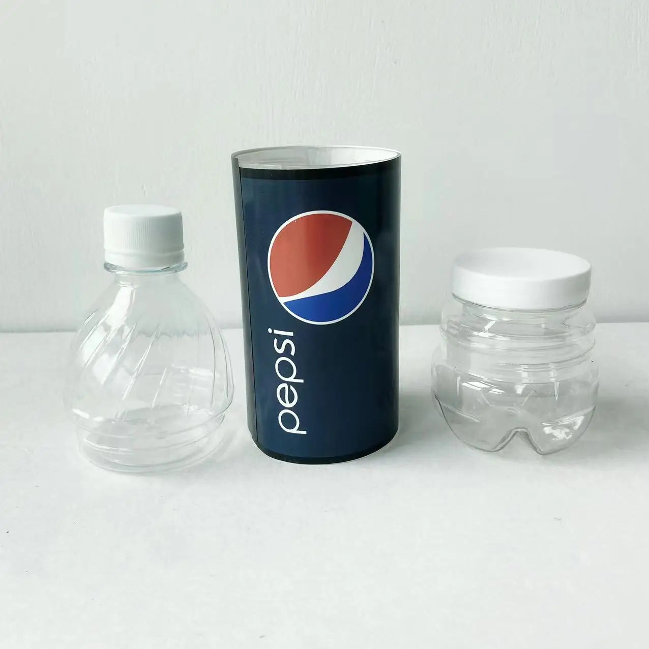 top middle and bottom of a pepsi clear bottle