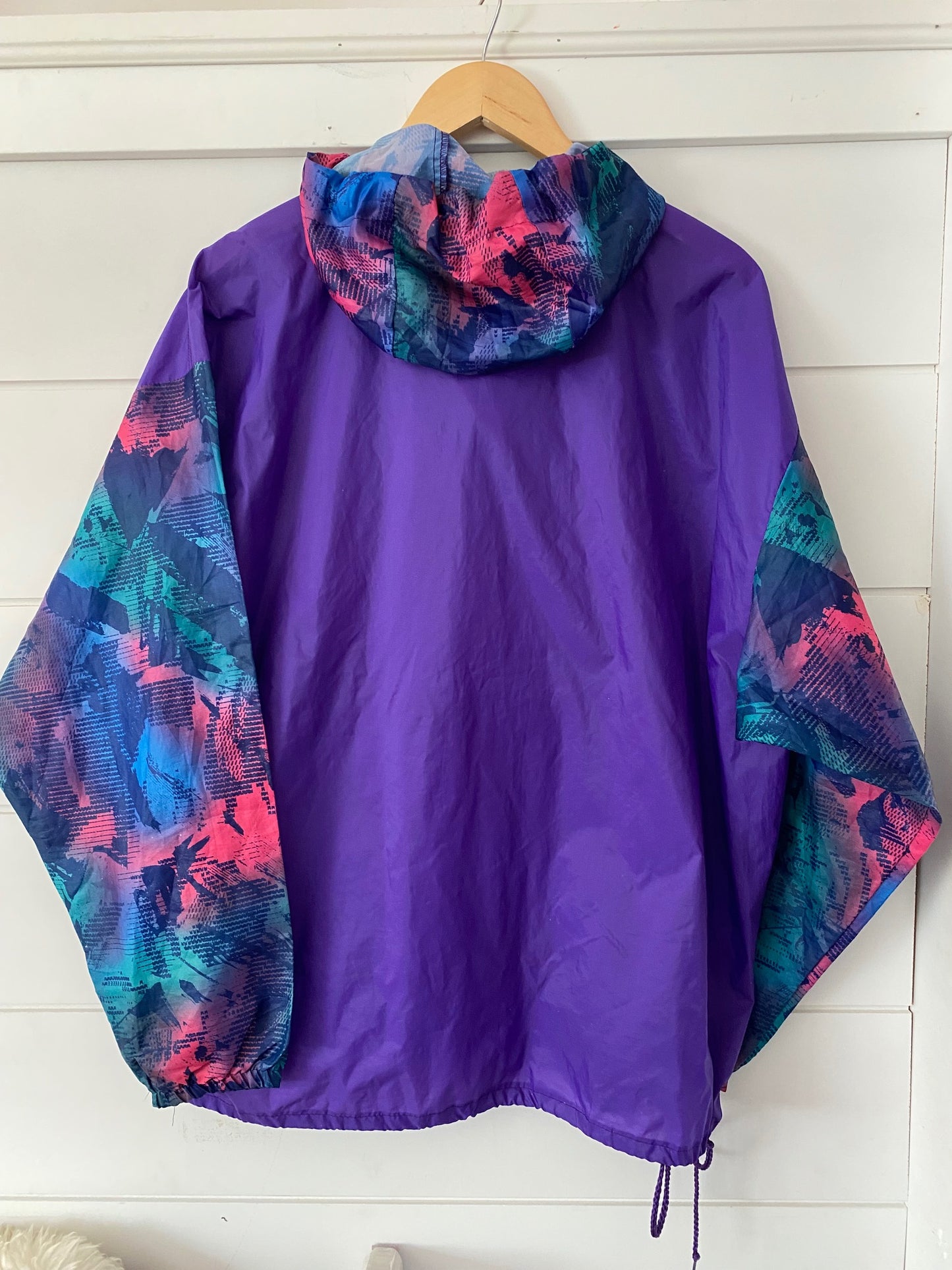 back view of a purple vintage original windberaker by k-way