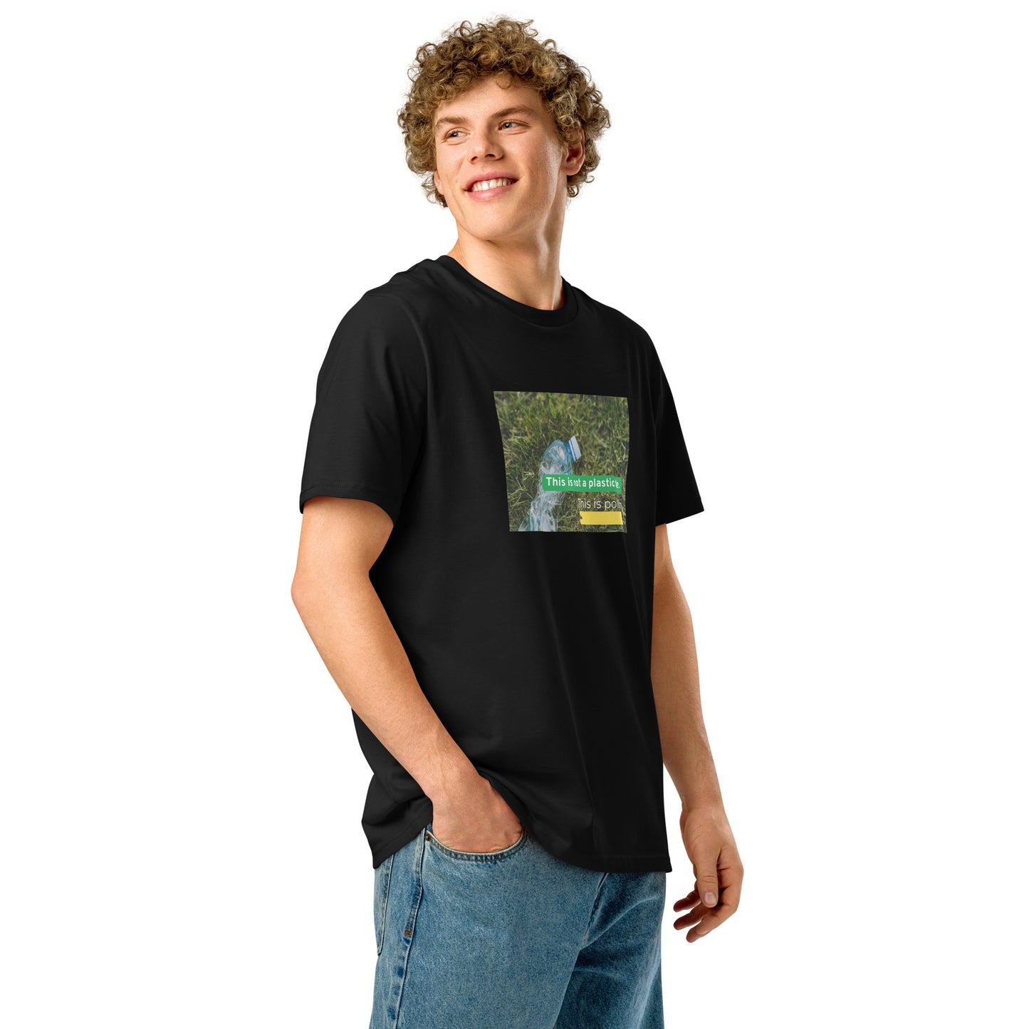 boy wearing a black t-shirt with a plastic bottle in front