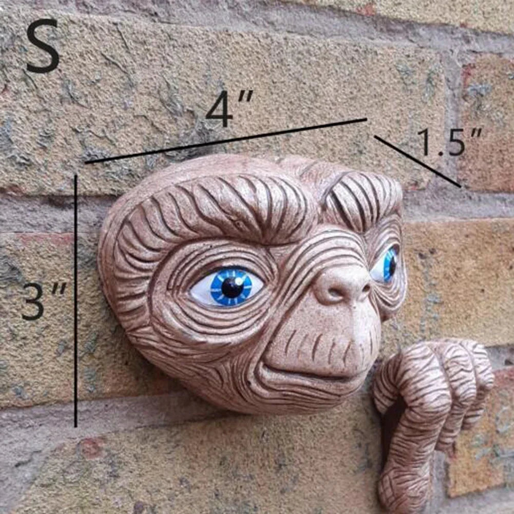 E.T. hang on a brick wall