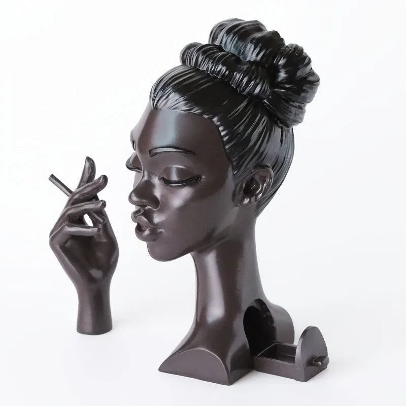 black plastic women holding a cigarette incense holder