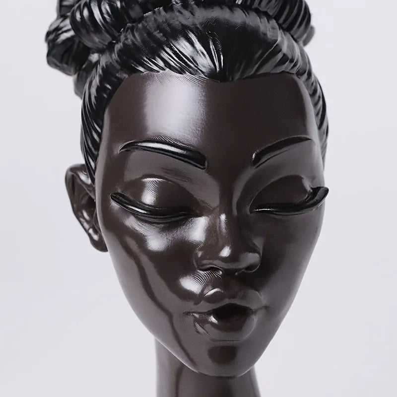 black plastic women head close-up view