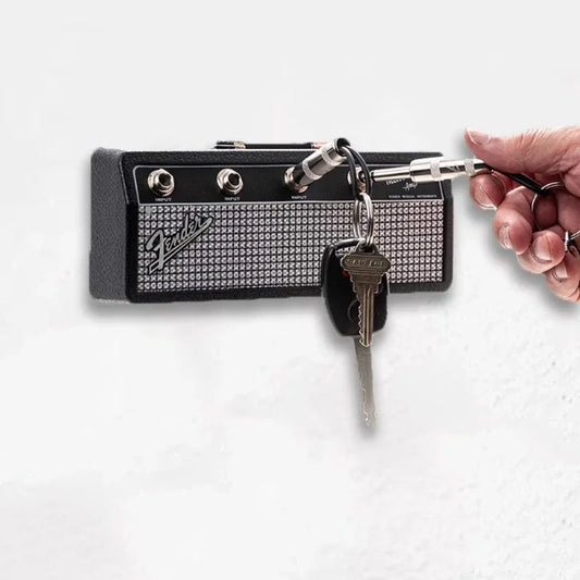 hand putting a key in a Fender key older ampli